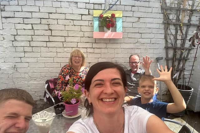 Nataliia, Yehor and Daniil with Phil and Karen at a local cafe