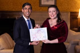 Rutland and Melton MP Alicia Kearns presents her Christmas card - designed by local schoolchildren following a competition - to Prime Minister, Rishi Sunak