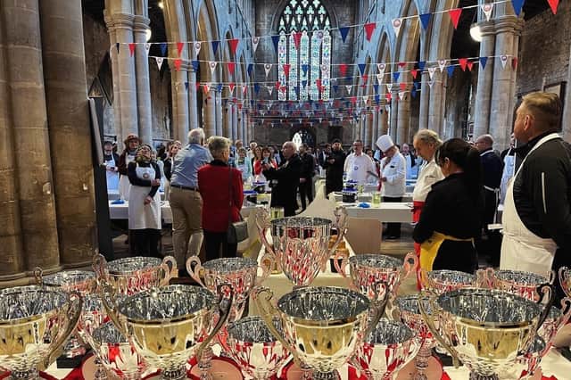 Judges assess the entries at the British Pie Awards yesterday at St Mary's Church, MeltonIMAGE Pullman Jack's Kitchen