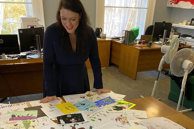 Melton MP Alicia Kearns sifts through the entries for last year's Christmas card competition