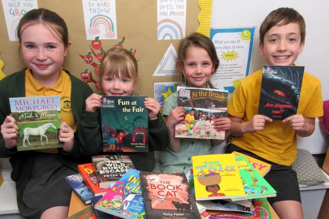 Scalford Primary School pupils with some of the books bought from the Ragdale Hall Community Chest funding