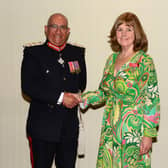 Dove Cottage Day Hospice founder Christine Gatfield receives her British Empire Medal from Lord-Lieutenant of Leicestershire, Mike Kapur