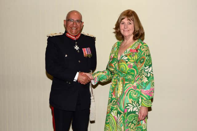 Dove Cottage Day Hospice founder Christine Gatfield receives her British Empire Medal from Lord-Lieutenant of Leicestershire, Mike Kapur