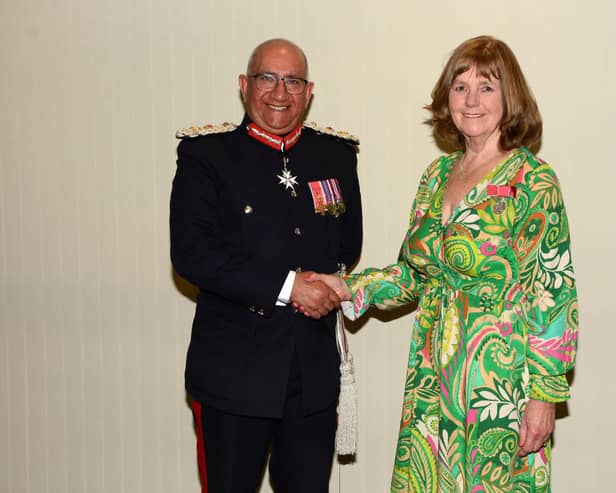 Dove Cottage Day Hospice founder Christine Gatfield receives her British Empire Medal from Lord-Lieutenant of Leicestershire, Mike Kapur