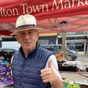 A stallholder gives the thumbs up to the new-look market