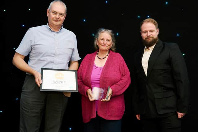 The Black Horse Community Group secretary, Carol Davis, and chairman, Mike Petty, receive their RCC award PHOTO Pete Martin