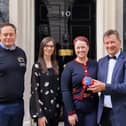 Representatives of Melton's Ye Olde Pork Pie Shoppe outside 10 Downing Street before the St George's Day reception