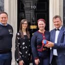 Representatives of Melton's Ye Olde Pork Pie Shoppe outside 10 Downing Street before the St George's Day reception