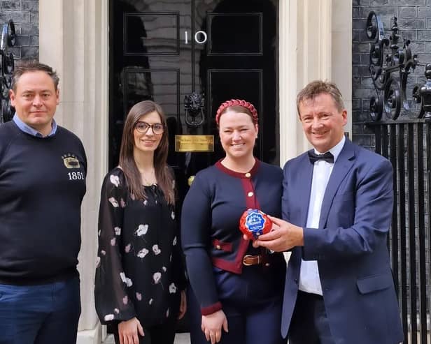 Representatives of Melton's Ye Olde Pork Pie Shoppe outside 10 Downing Street before the St George's Day reception