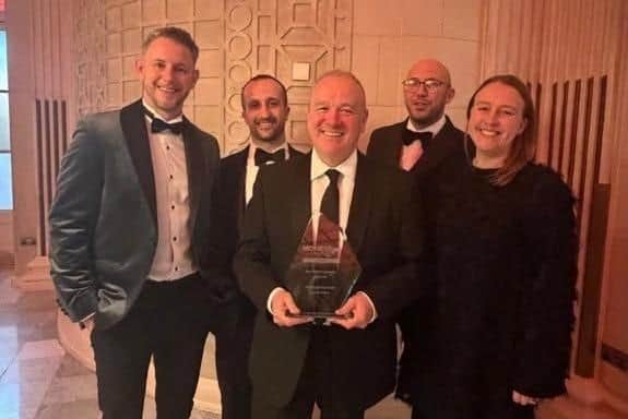 Staff at Melton Building Society pictured after receiving their Best Charity Partnership win at the MoneyAge Awards