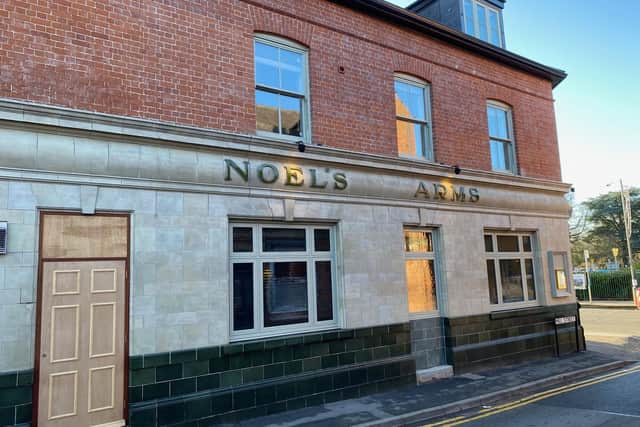 The impressive exterior of the Noel's Arms - 60 years of paint has been taken off as part of a heritage restoration