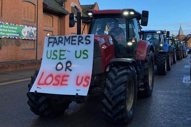 A convoy of tractors passing through Melton Mowbray town centre on a continuous loop during today's protest