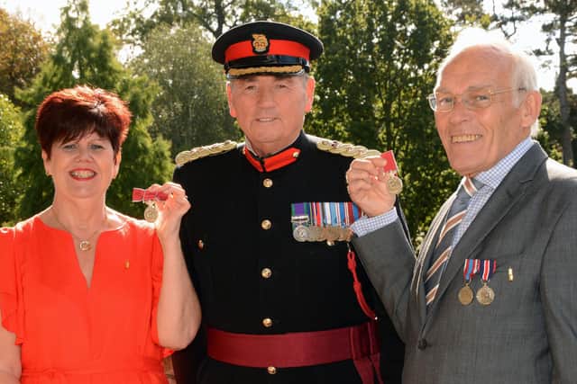 British Empire Medal recipients Peter Blount and Maureen O'Malley with Col Murray Colville