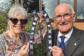 New Melton Mowbray Townwarden Ian Neale takes the chain of office from Adrienne Holland, who previously had the role