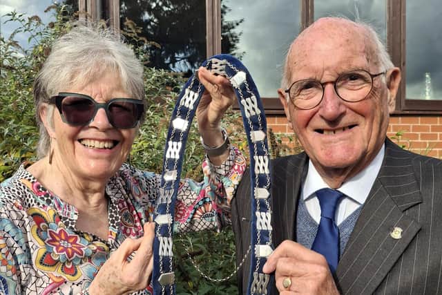 New Melton Mowbray Townwarden Ian Neale takes the chain of office from Adrienne Holland, who previously had the role