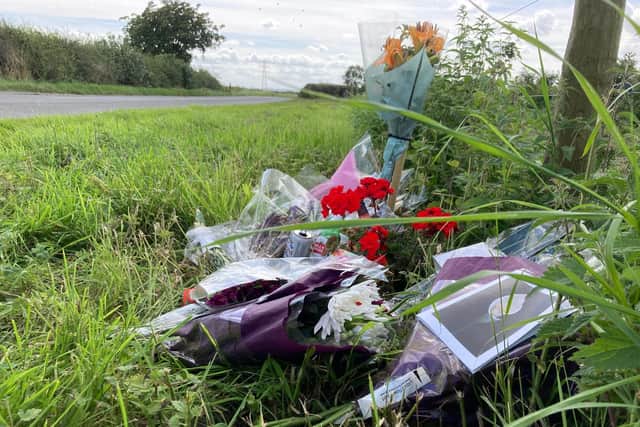 Floral tributes left by the side of Melton Spinney Road, near Scalford, after the death of cyclist