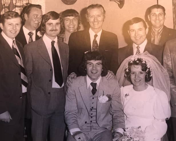 Jonny and Susannah Garland on their wedding day in April 1974 with some of his football team-mates