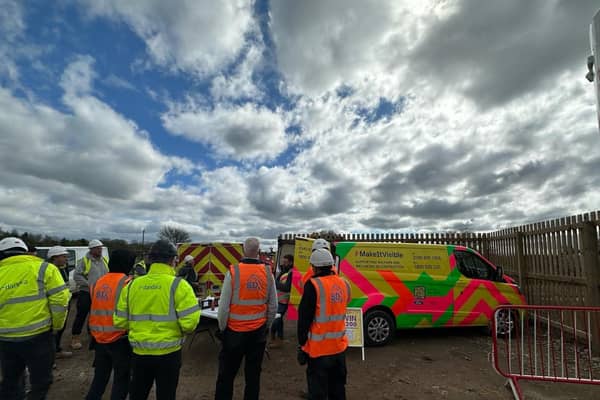 Representative from the Lighthouse Club charity offer advice to workers at the Dandara construction site at Wymeswold