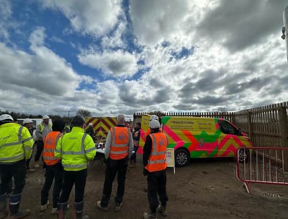 Representative from the Lighthouse Club charity offer advice to workers at the Dandara construction site at Wymeswold