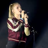 Hannah Reid of London Grammar; the Ivor Novello Award-nominated act are set to headline Latitude Festival this weekend at Henham Park, Suffolk (Credit: Getty Images)
