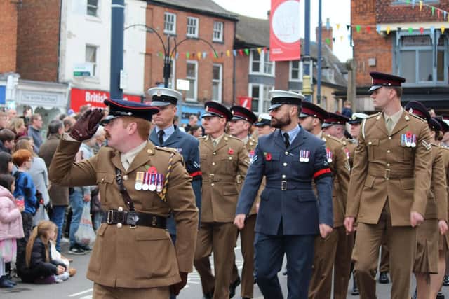 A recent Remembrance Sunday parade passes through Market Place in Melton Mowbray