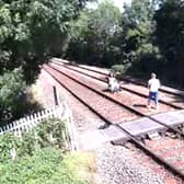 Two people trespassing on the railway track and captured on CCTV