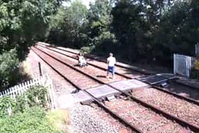 Two people trespassing on the railway track and captured on CCTV