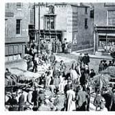 A cheese fair held in Melton Mowbray town centre in yesteryear
