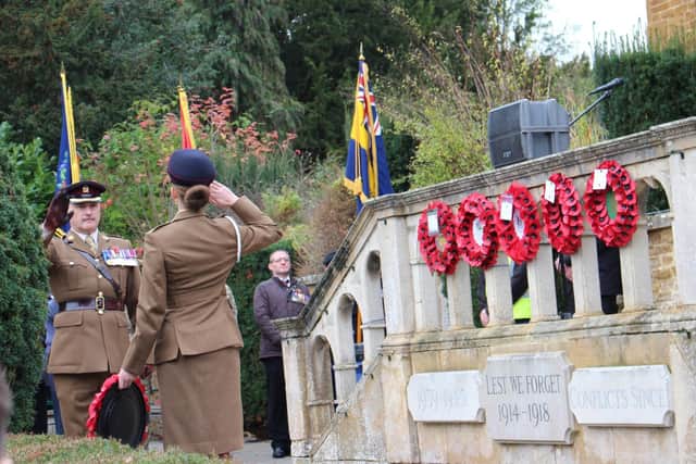 Army personnel laying a wreath at Melton's war memorial