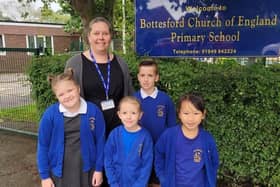 Head teacher Emma Barker with some of her pupils at Bottesford CE Primary School