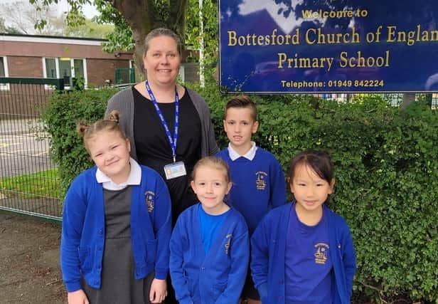 Head teacher Emma Barker with some of her pupils at Bottesford CE Primary School