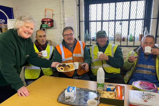 Mary Noble serves her cakes to Grantham Canal Society volunteers
