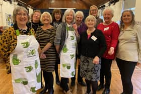Some members of the Wymondham WI celebrate their centenary in the village hall