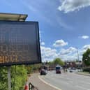 A sign on Norman Way advertising the A607 closure with the left hand lane reopened again to traffic heading to Thorpe Road
