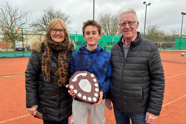 Reg and Jennie Hughes present Ben England with his Shane Hughes Shield.