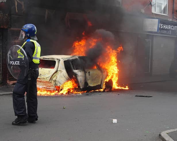 A car burns on Parliament Road, in Middlesbrough, during an anti-immigration riot. Credit: Owen Humphreys/PA Wire