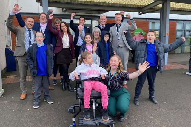 Students and staff at Melton's Birch Wood Special School with representatives from Discovery Trust as they celebrate linking up
