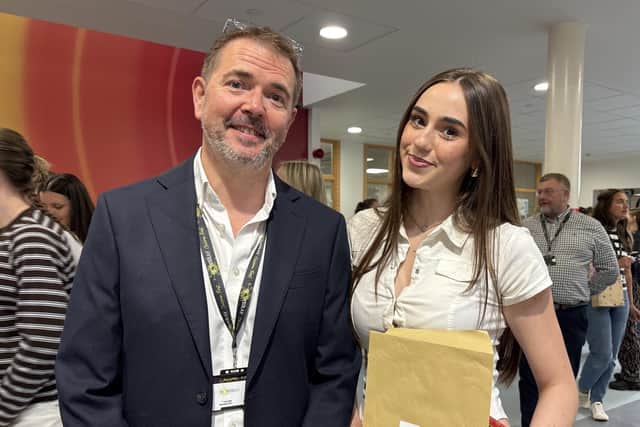 Lily Grant with John Ferneley College headteacher Terry Claridge