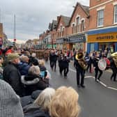 The Melton Band leads the Melton Mowbray Remembrance Sunday parade through Sherrard Street