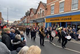 The Melton Band leads the Melton Mowbray Remembrance Sunday parade through Sherrard Street