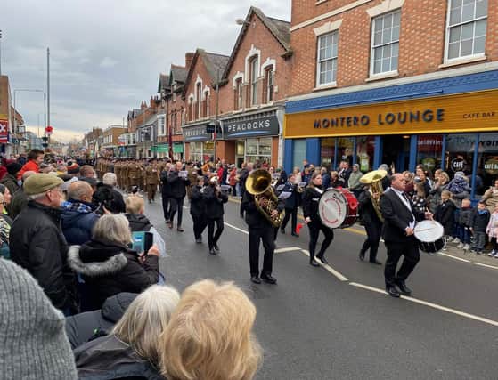 The Melton Band leads the Melton Mowbray Remembrance Sunday parade through Sherrard Street