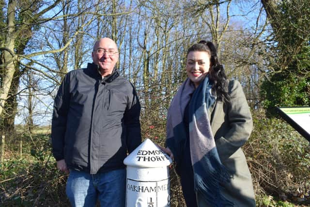 MP Alicia Kearns poses by the restored milepost by the former Oakham Canal