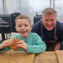 Youngsters enjoying burgers with Matthew Hoggard at his Hoggy's Grill business