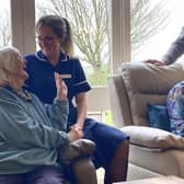 A guest is supported by one of the team members at Dove Cottage Day Hospice at Stathern