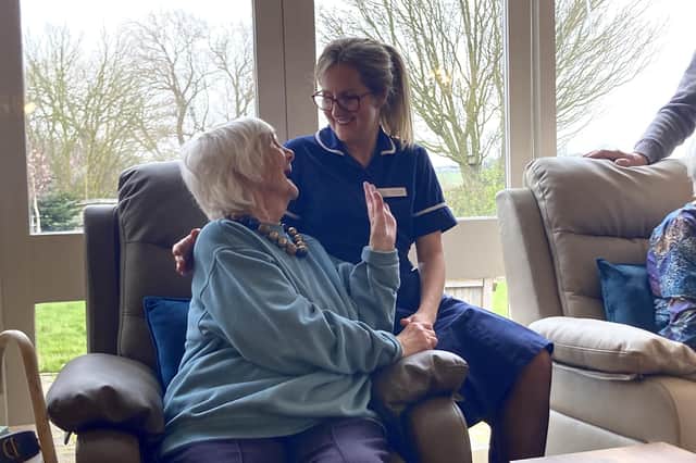 A guest is supported by one of the team members at Dove Cottage Day Hospice at Stathern