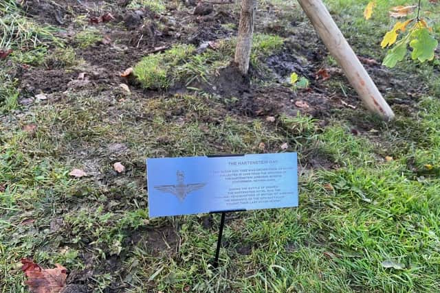 A plaque at the site of the new tree planting at the Burrough war memorial