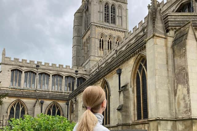 Nadiia admires St Mary's Church after escaping the Ukraine war (Nadiia asked us not to identify her in the photograph as she settles into life in the town)