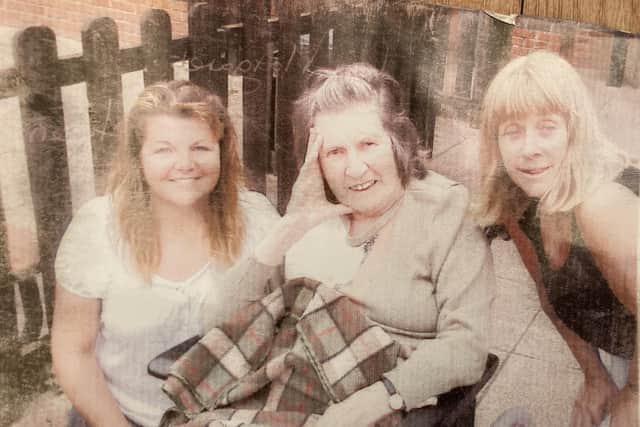 Vera Foster pictured in 2014 with family after she had become wheelchair bound following a car accident