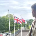 Councillor Joseph Boam, deputy leader of Leicestershire County Council, pictured with flags at County Hall