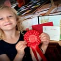 Bow Woods was awarded Stathern Village Show's Shirley Keir Cup for Children’s Best in Show for her painting of the bell tower.